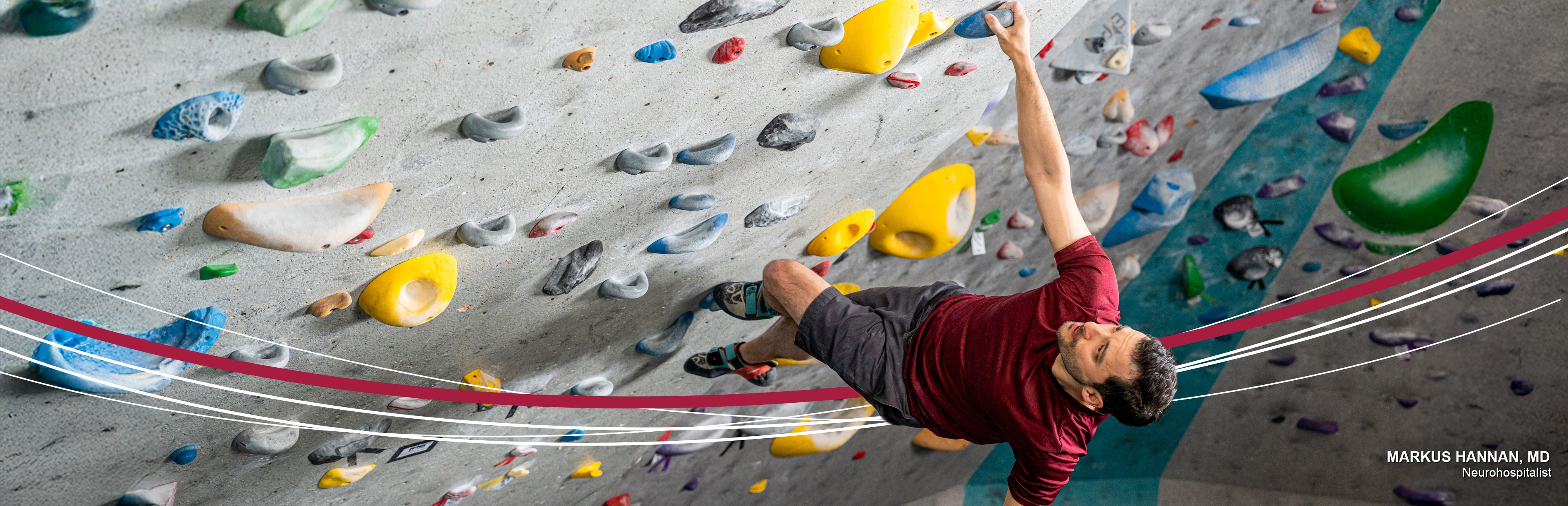 Man bouldering on an indoor climbing wall